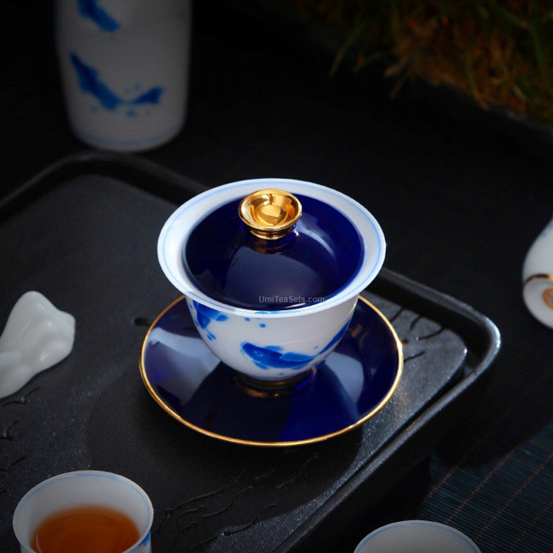 Set of high quality goldfish tea set displayed on a tea table ready for serving