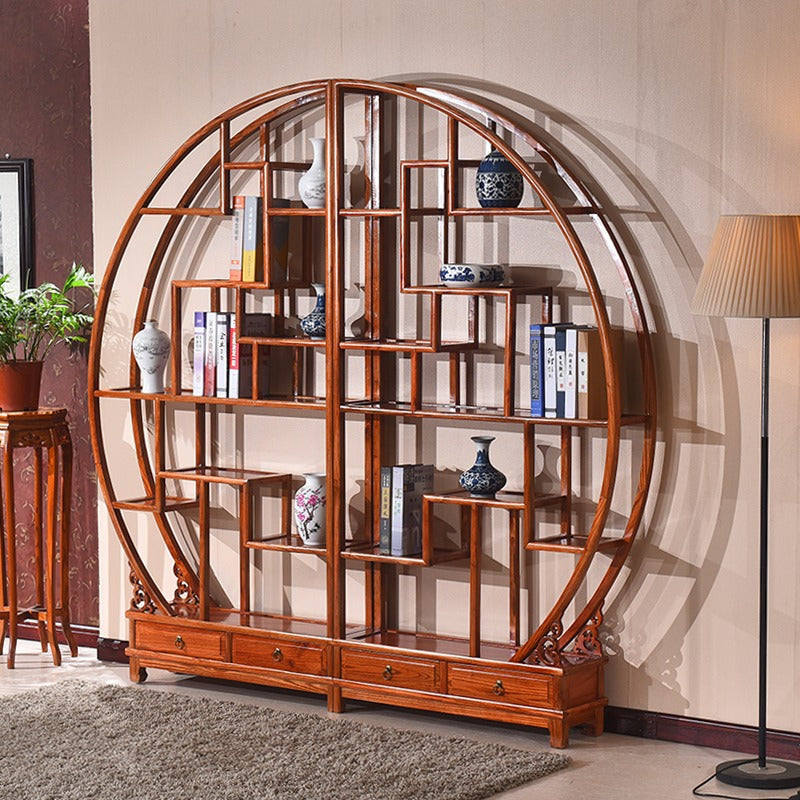 View of the elegant round curio cabinet showcasing tea sets and collectibles.