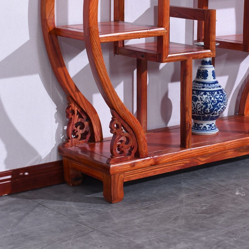 Elegant display shelf for collectibles in a cozy tea room setting