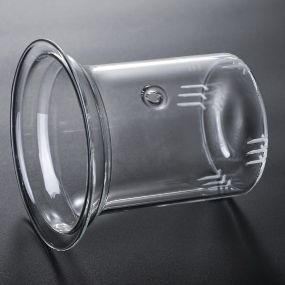 Close-up of colorful handle glass teapot with infuser for flowering tea