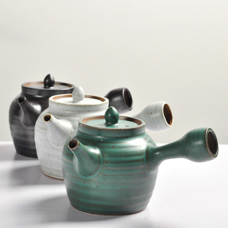 Elegant Coarse Pottery Japanese Teapot Set from a side angle, highlighting its sleek design and matte finish.