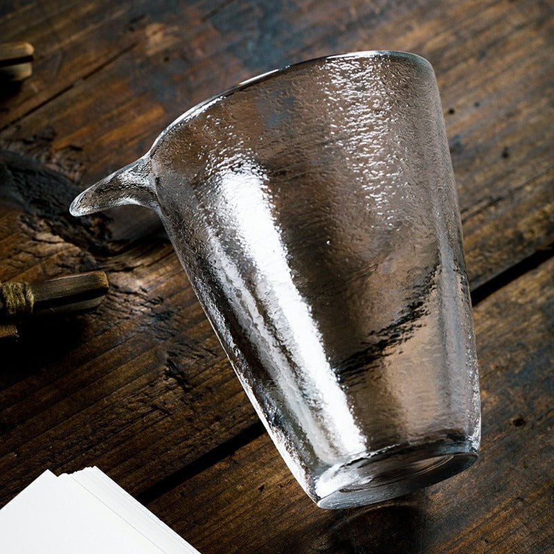 Overhead view of large tea mug with gold trim filled with jasmine tea