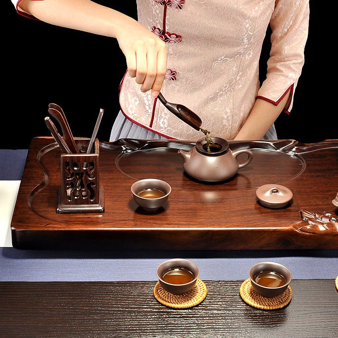 All six pieces of the Black Hollow tea utensil set arranged elegantly on a tea tray, ready for use.