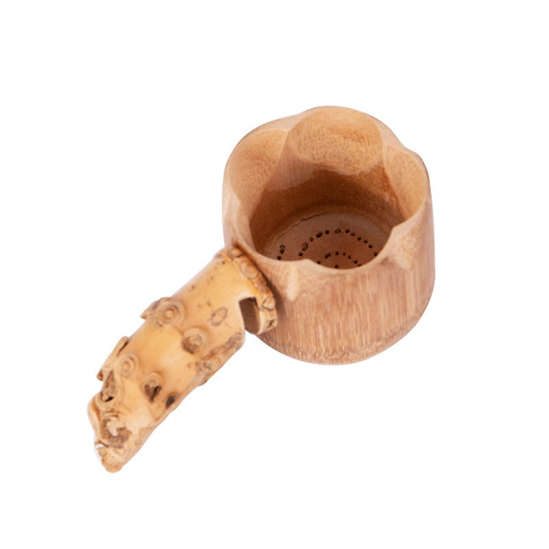 Bamboo tea strainer in use, highlighting the seamless pour of brewed tea without leaves.
