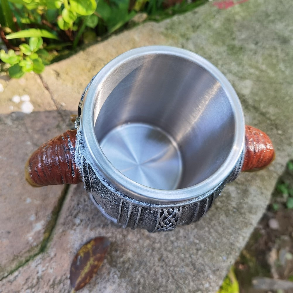 Close-up of stainless steel skull mug with detailed design