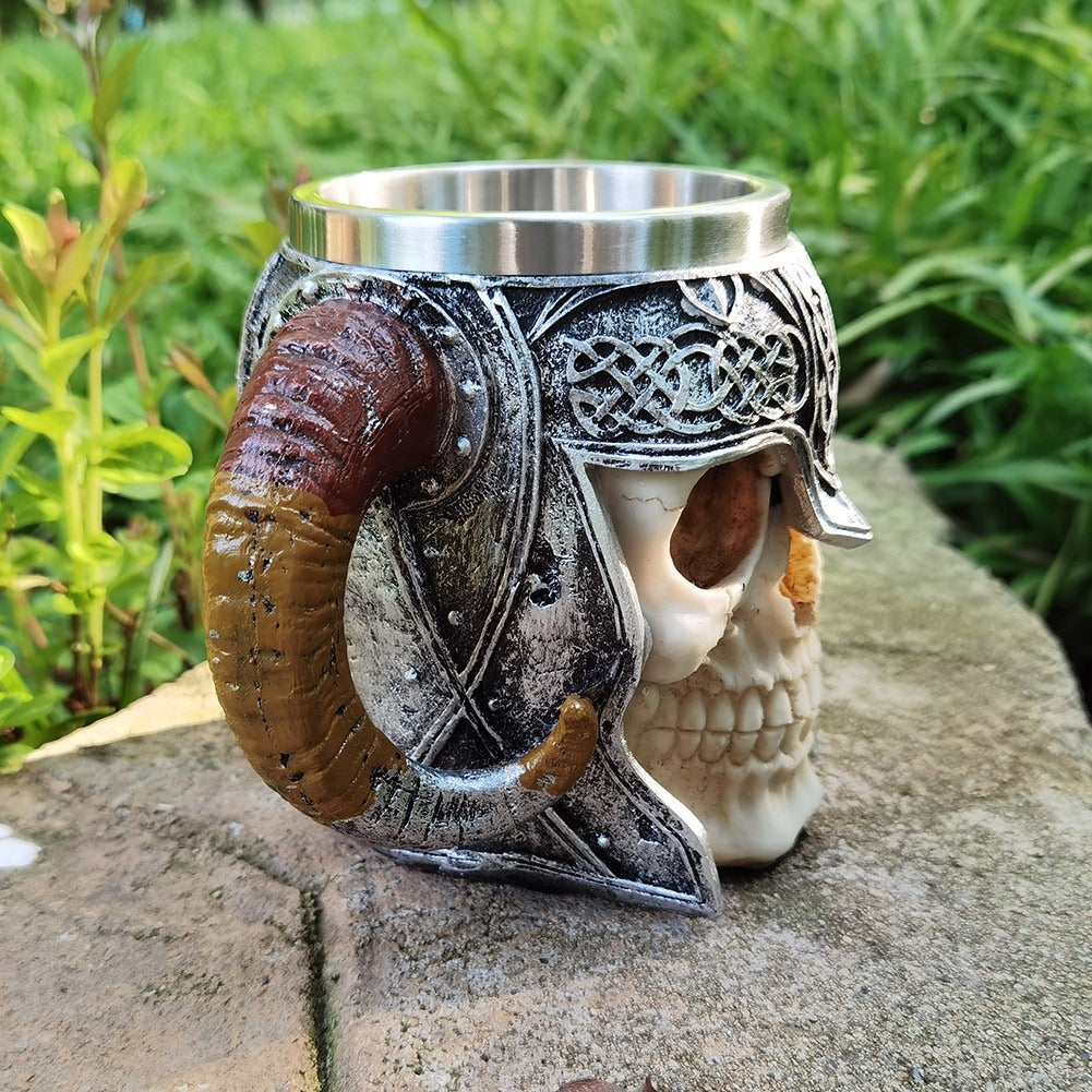 Travel setup featuring the thermal travel mug with skull and helmet motifs