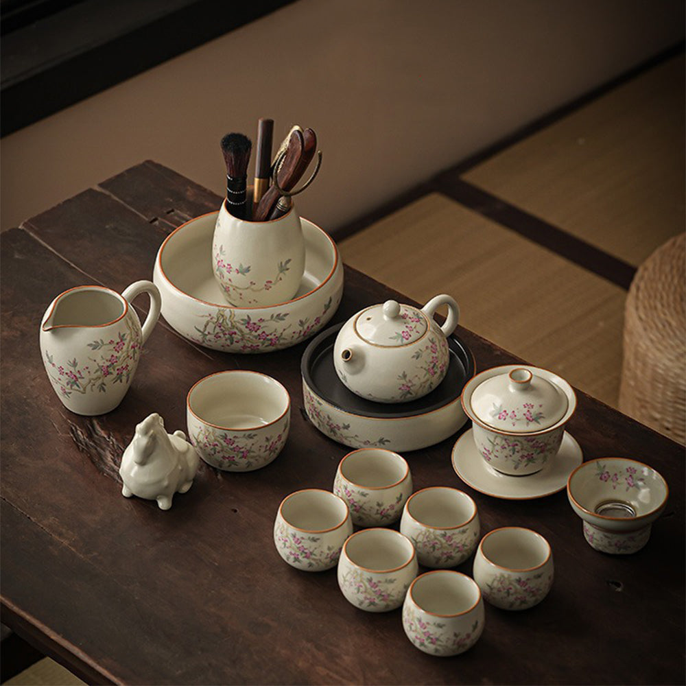 Elegant Peach Blossom Ru Yao Kung Fu Tea Set displayed on a wooden table, highlighting the intricate peach branch pattern.