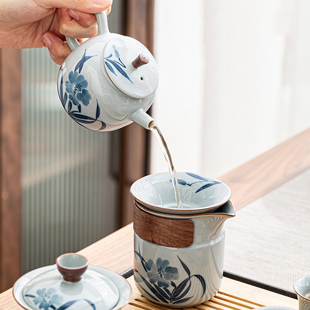 Complete ceramic tea set with teapot, cups, and filter for traditional Chinese tea brewing