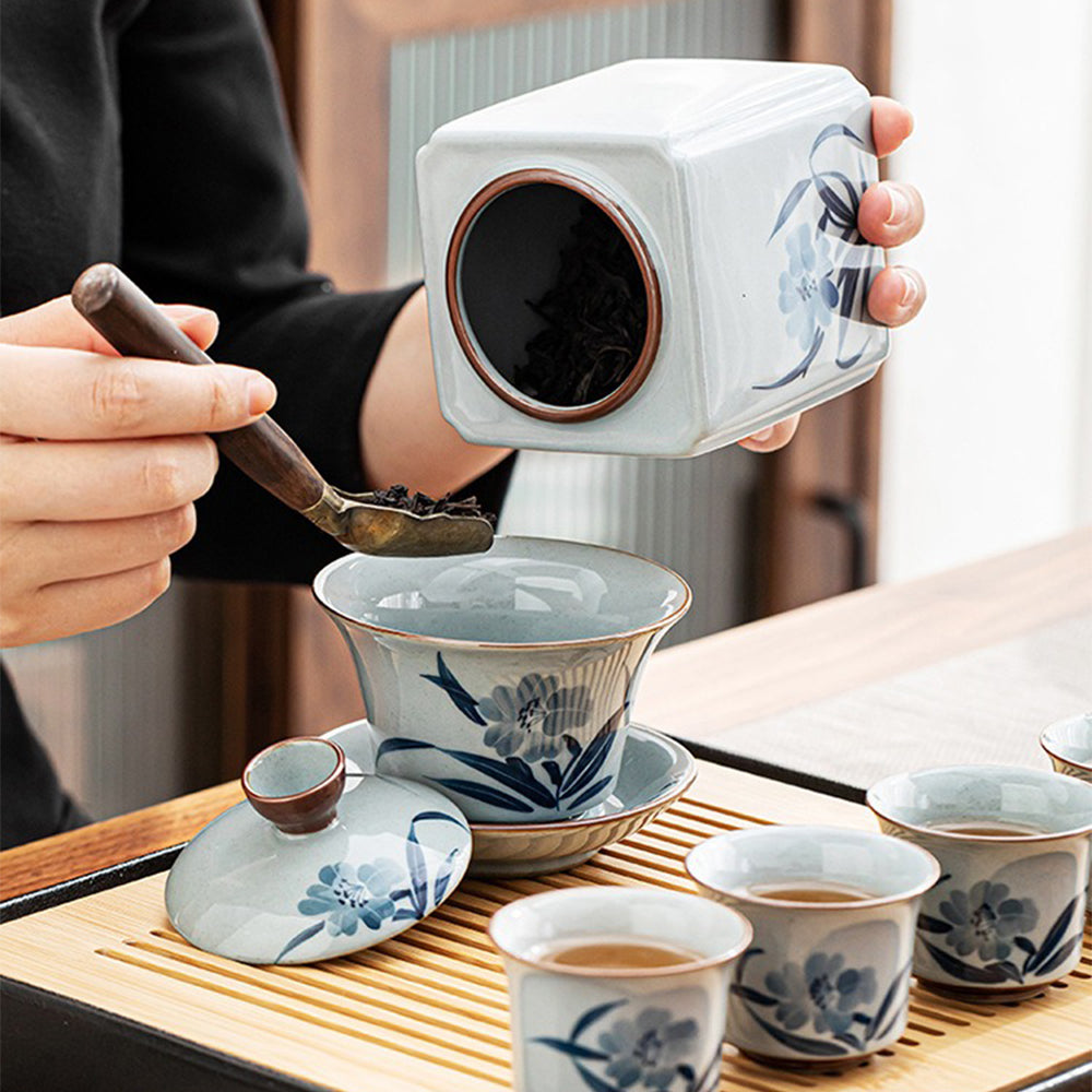 Complete ceramic tea set with teapot, cups, and filter for traditional Chinese tea brewing