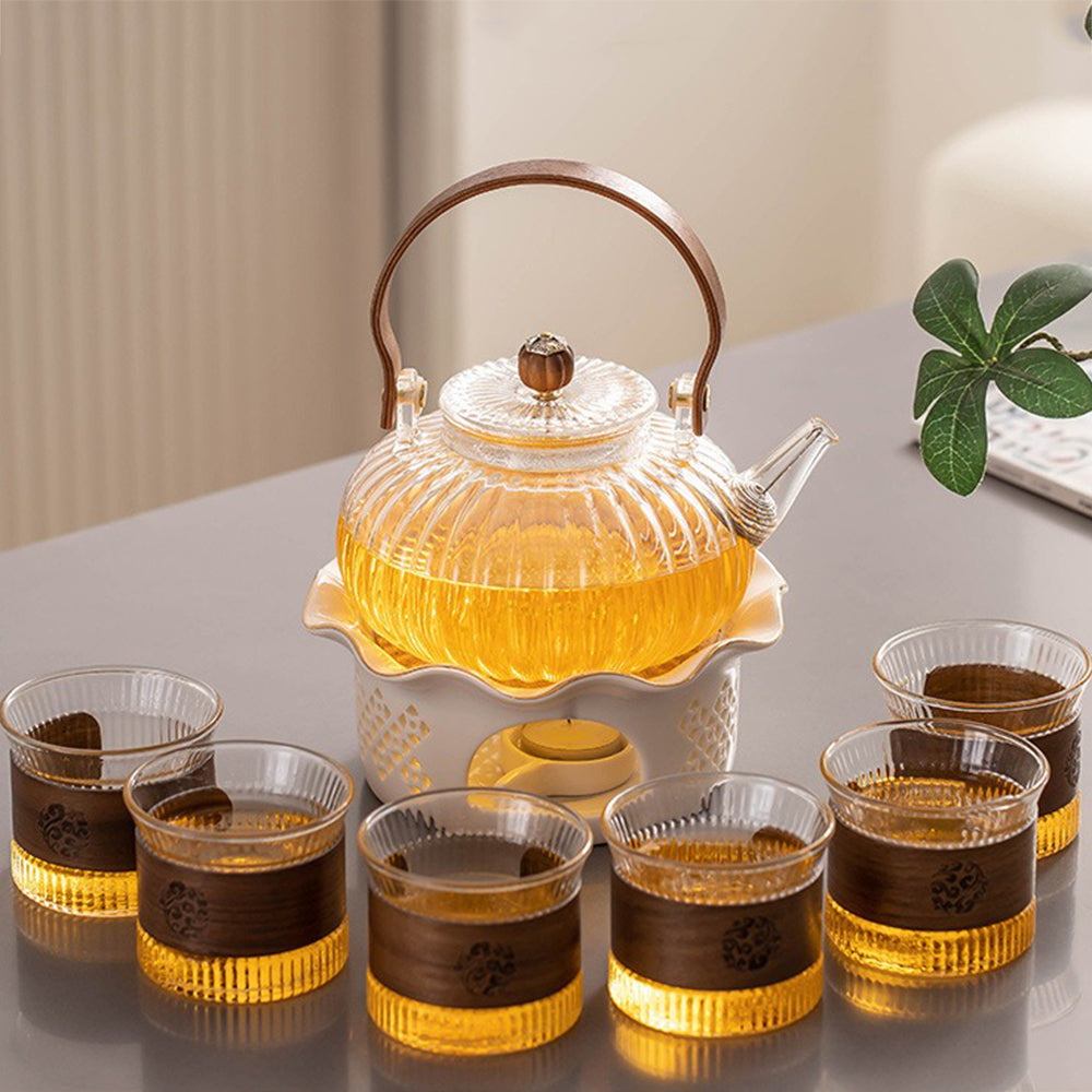 Close-up of the intricate pumpkin stripe design on the glass teapot and cups.