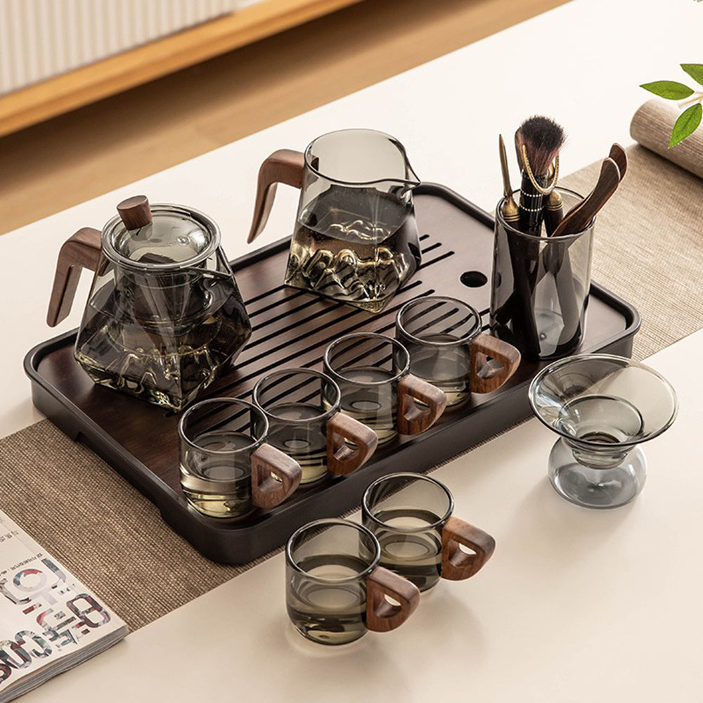 Mountain View Premium Glass Tea Set from a side angle, showcasing its elegant design and wooden handles.