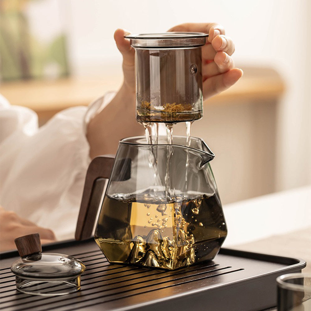 Close-up of the heat resistant glass tea pot and cups, highlighting the unique mountain-shaped base.