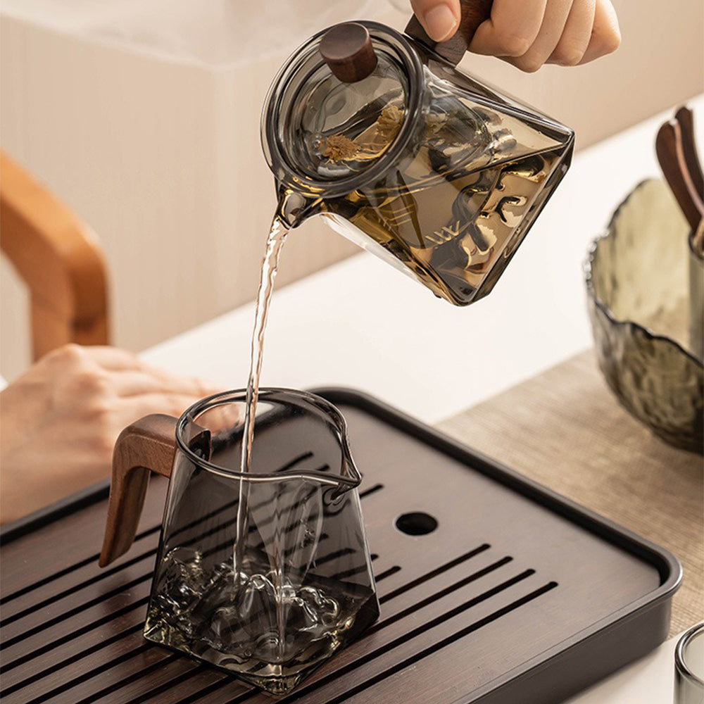 Full setup of the mountain glass tea set on a table, displaying all components including the tea tray and utensils.