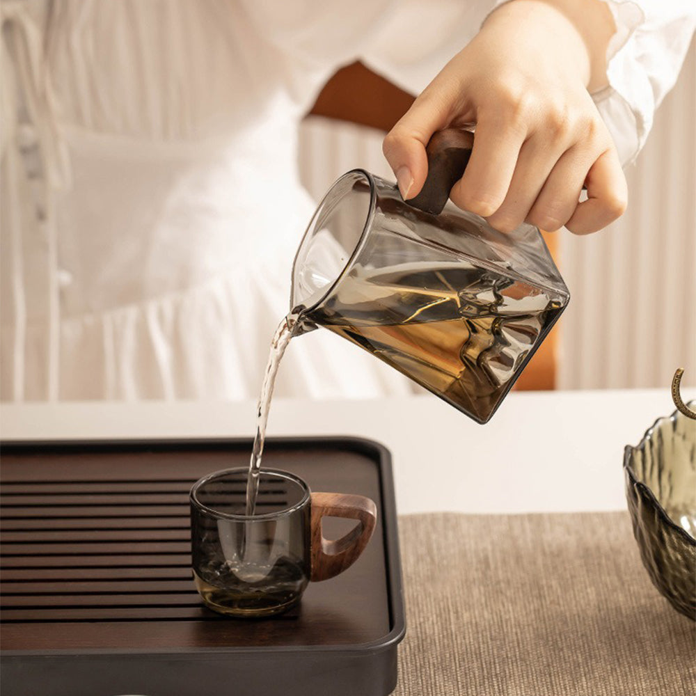 Mountain View Premium Glass Tea Set from a side angle, showcasing its elegant design and wooden handles.