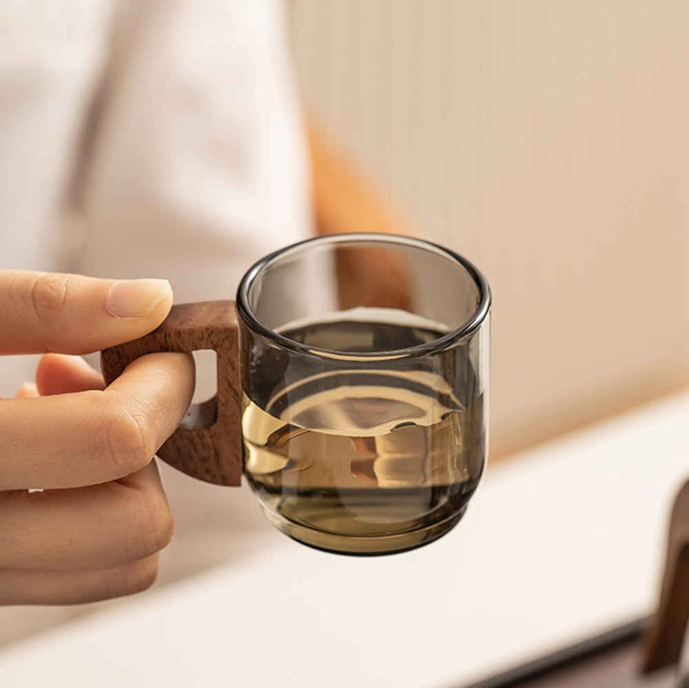 Close-up of the heat resistant glass tea pot and cups, highlighting the unique mountain-shaped base.