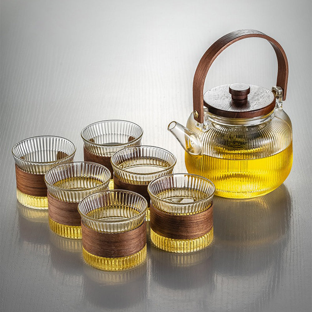 Close-up of the vertical striped glass teapot with wooden handle