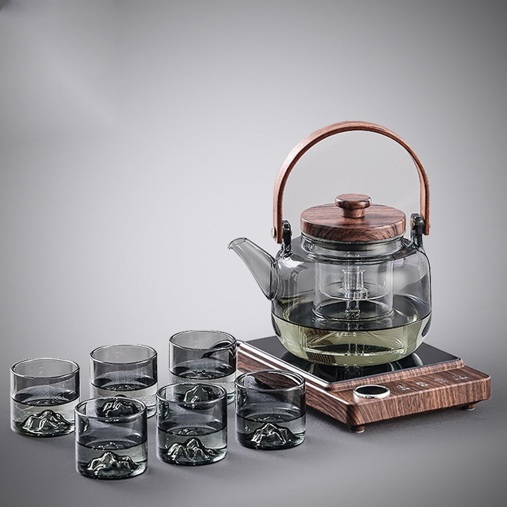 Close-up of the high-quality glass teapot with induction warmer, showcasing its sleek design and heat-resistant glass.