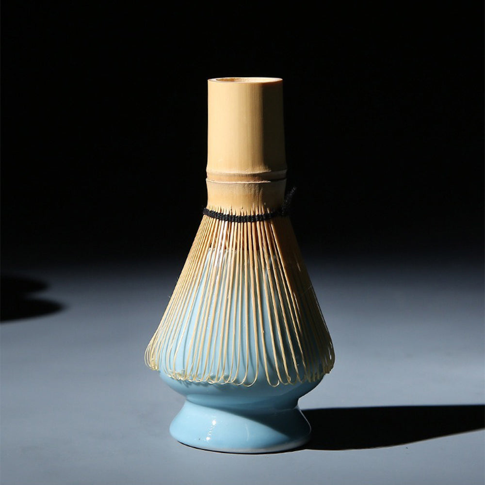 Elegant Japanese matcha bowl with tea whisk and cup, ready for preparation