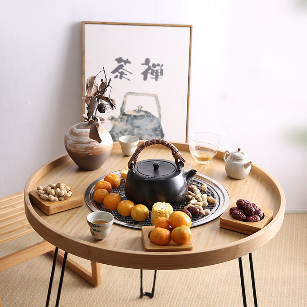 Family enjoying tea around the walnut wood stove tea table in winter