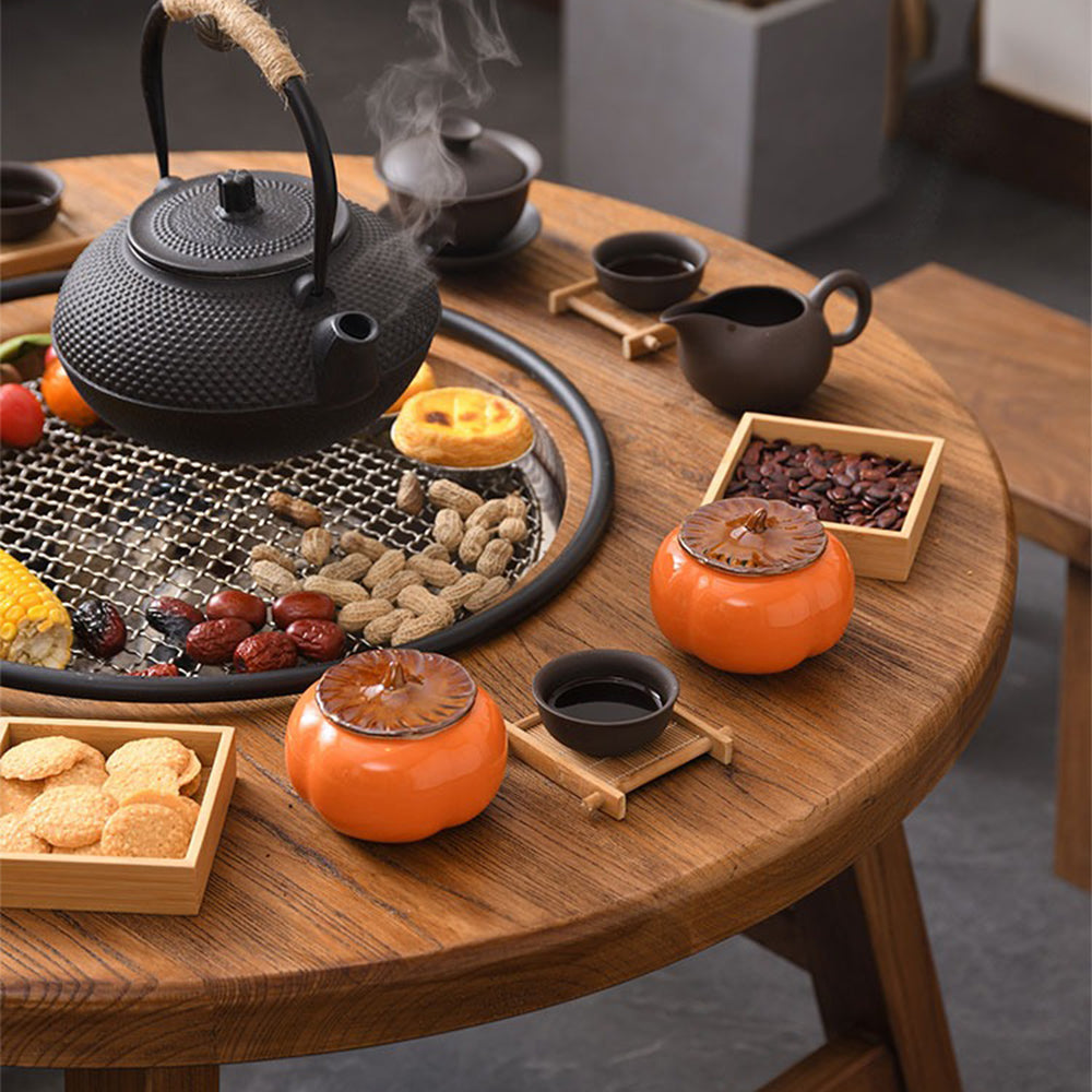 Electric ceramic stove tea table displayed in a stylish living room setting.