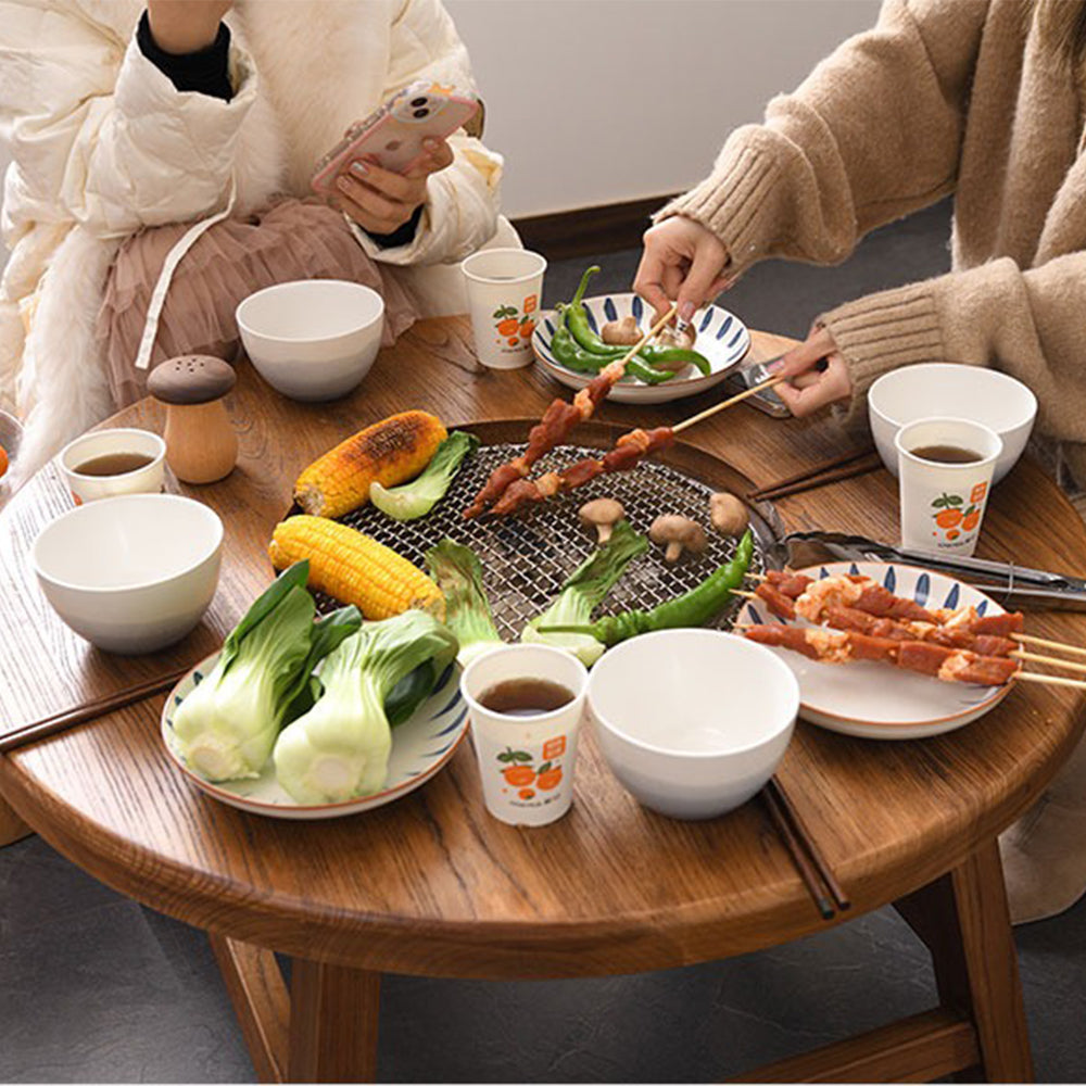 Electric ceramic stove tea table displayed in a stylish living room setting.