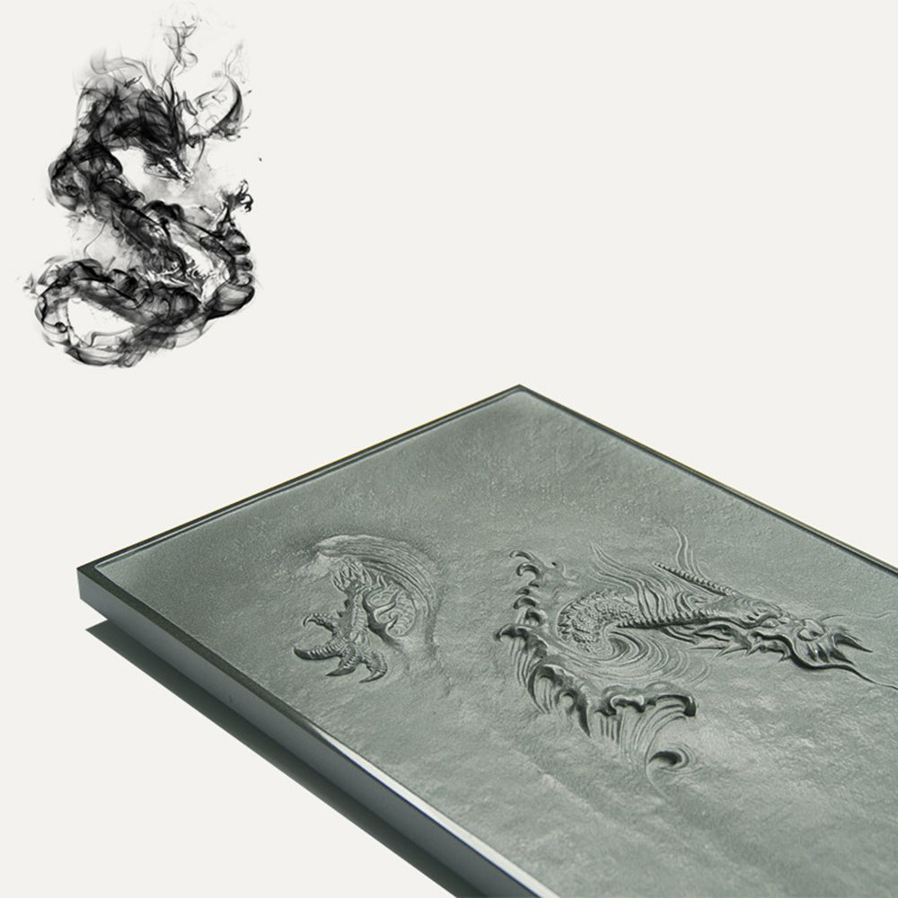 Close-up of the dragons head on the stone tea tray, illustrating the craftsmanship and relief details.