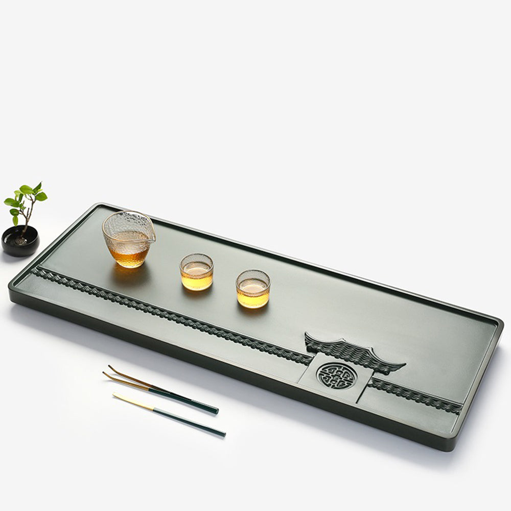 Side view of the stone tea tray demonstrating its elegant design and hidden drainage outlet.