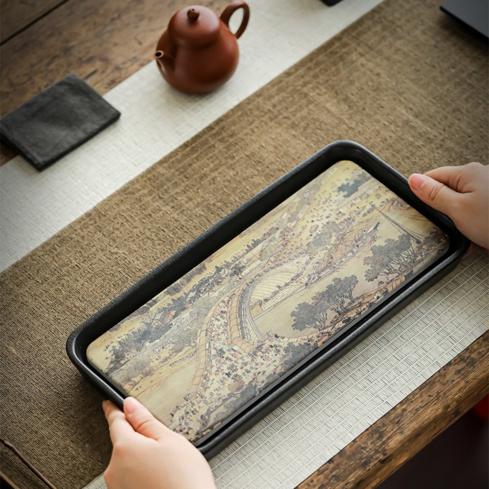 Tea tray in use with teapot and cups, showcasing its role among high quality tea utensils set