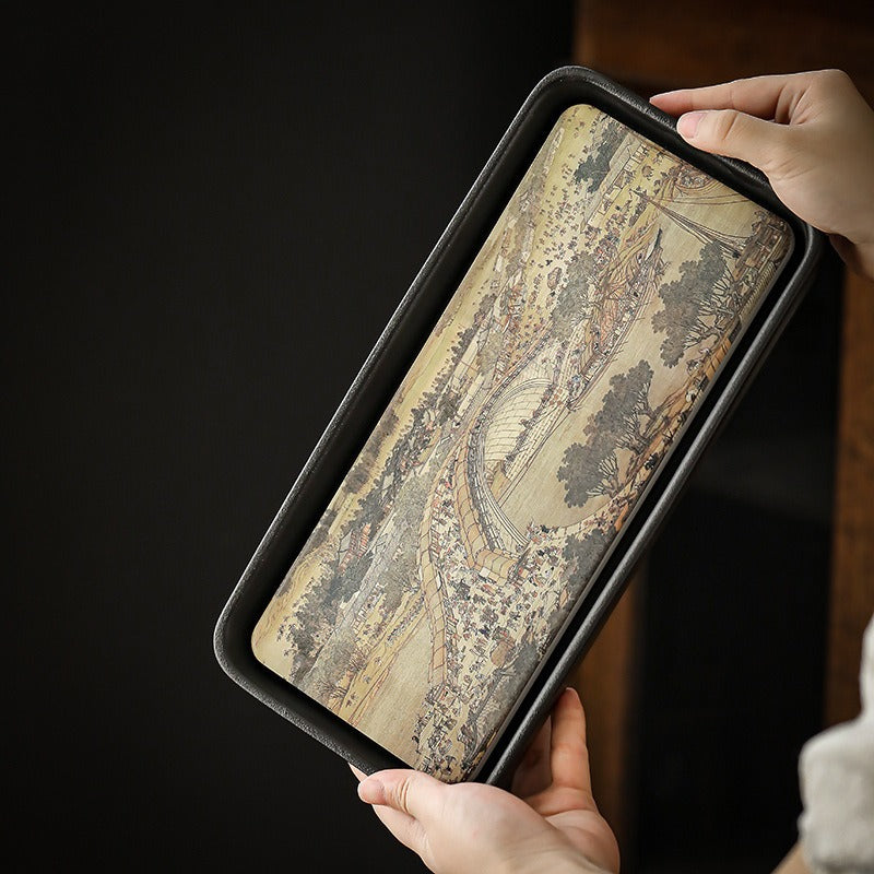 Top view of Qingming ceramic tea tray showing ink-style pattern and water-absorbing surface