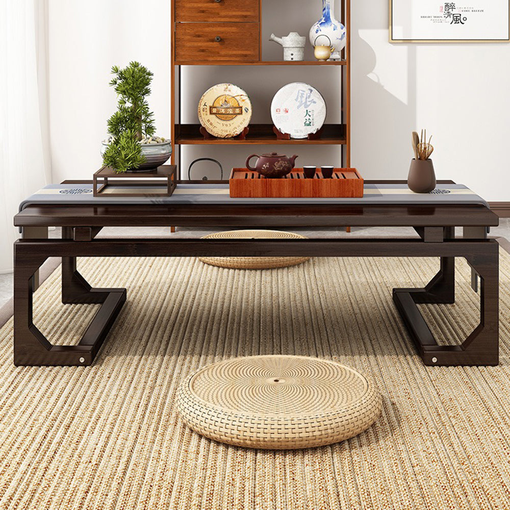 Side view of a modern low sitting table with curved legs and polished surface