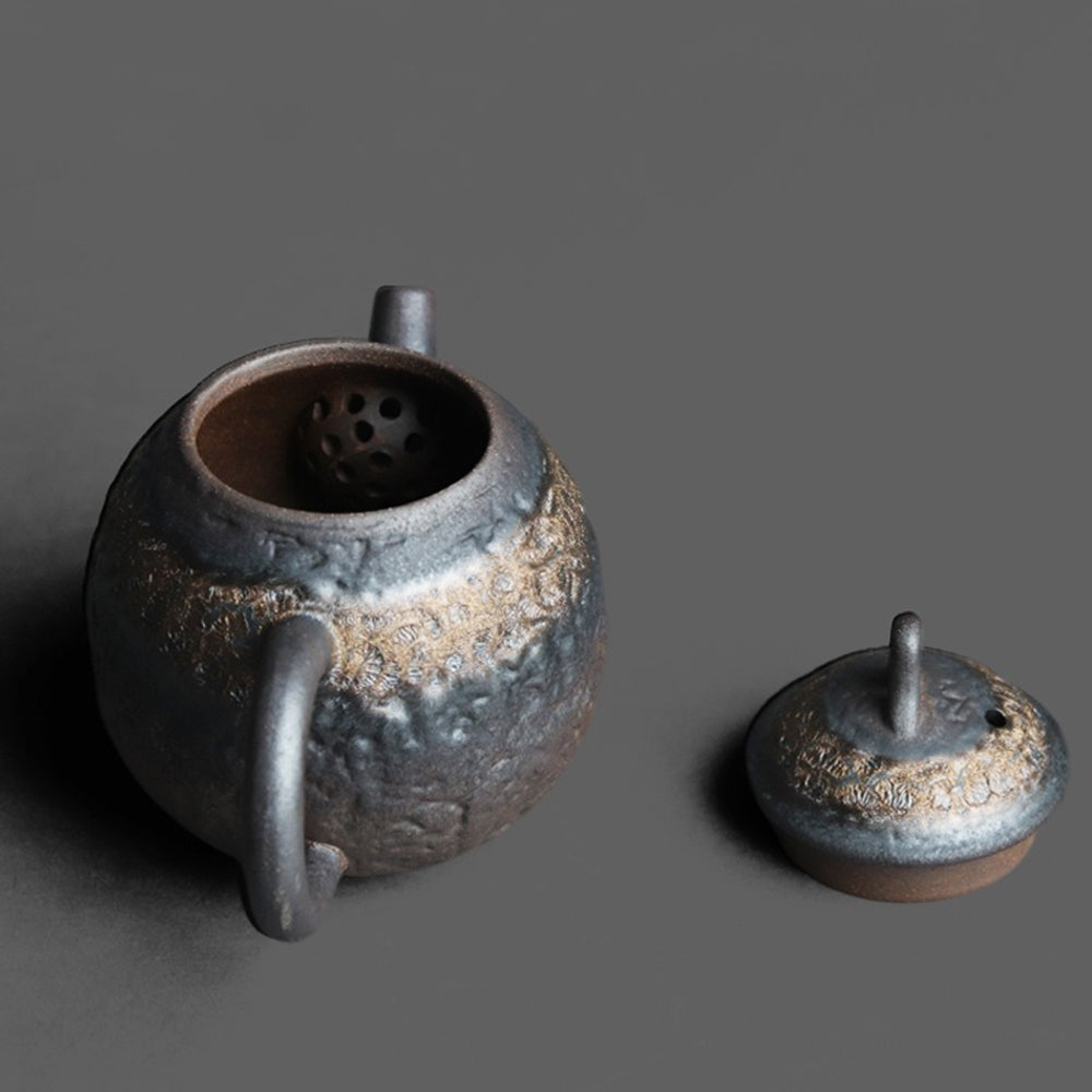 Lifestyle shot of the teapot in use as part of a traditional Chinese tea set