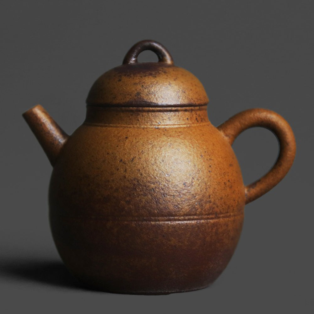 Front view of vintage Chinese ceramic teapot with natural glaze