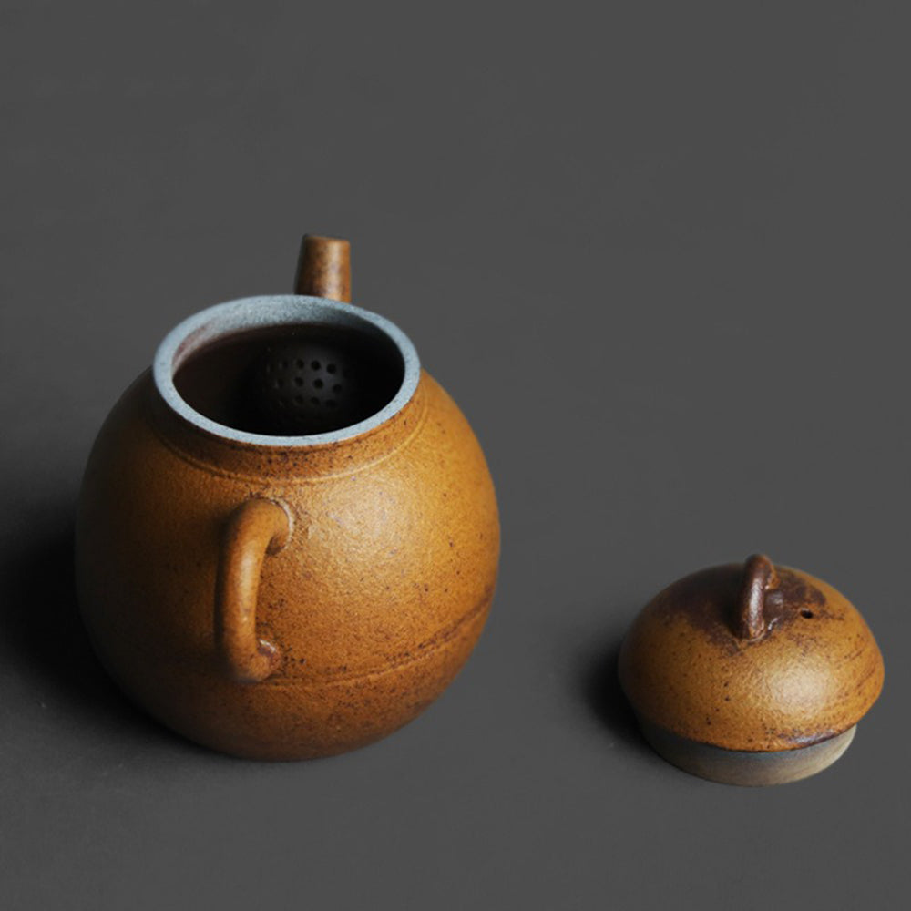 Front view of vintage Chinese ceramic teapot with natural glaze