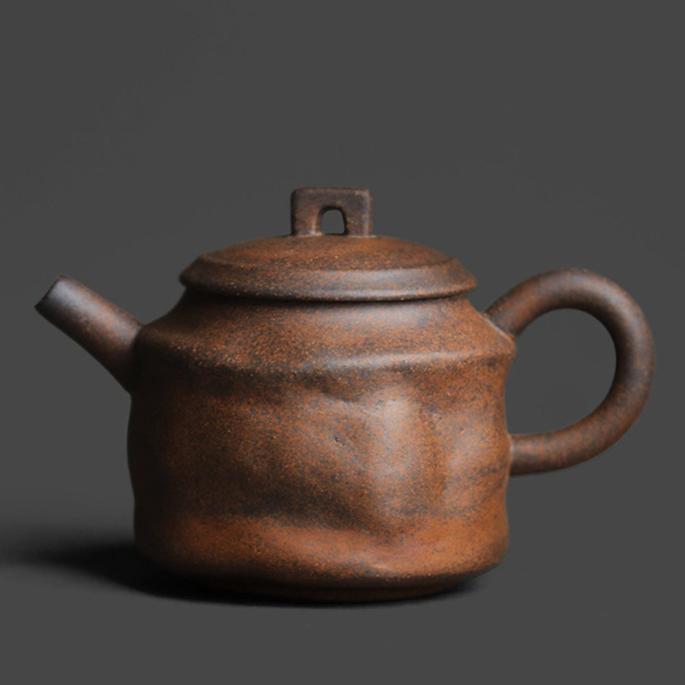 Handcrafted vintage rock clay pavilion teapot with earthy texture, ideal for tea brewing