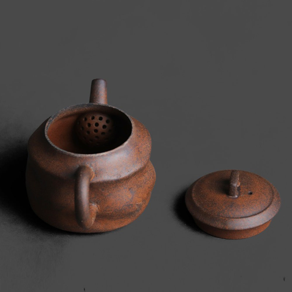 Handcrafted vintage rock clay pavilion teapot with earthy texture, ideal for tea brewing