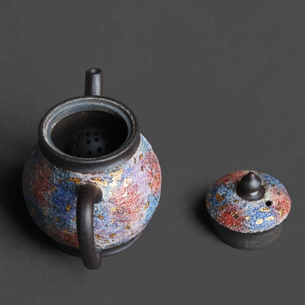 Close-up of the teapot spout and lid, showcasing handcrafted details and sandstone finish