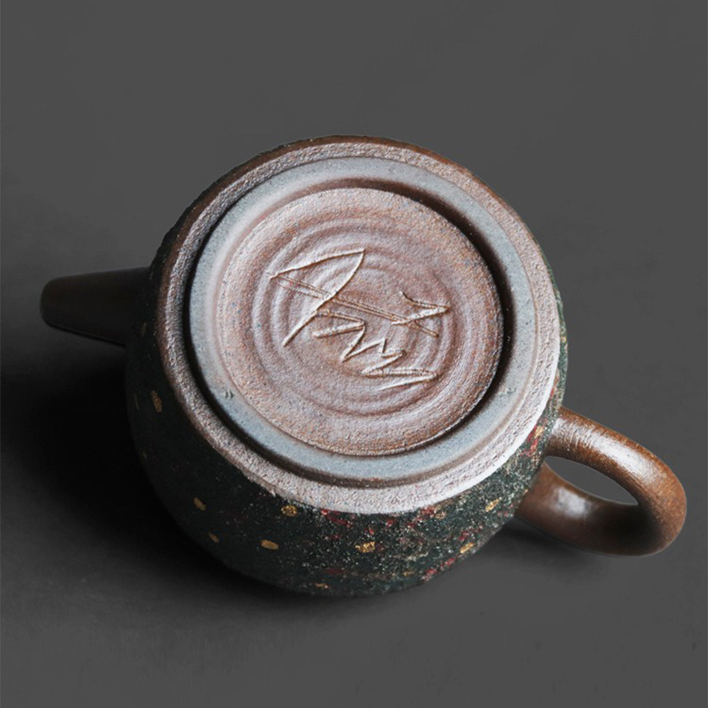 Interior view of mineral teapot with spherical filter holes for clear tea brewing