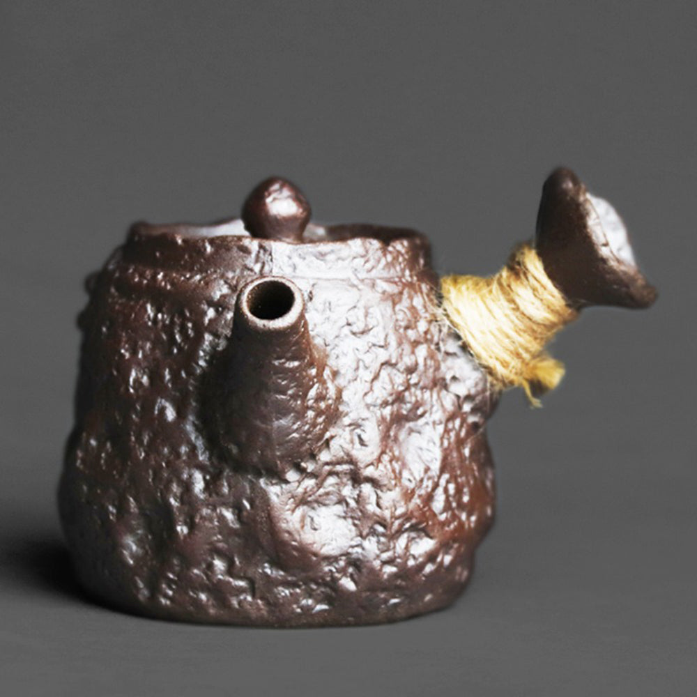 Japanese Kyusu stone texture teapot with side handle and textured clay surface for authentic tea brewing