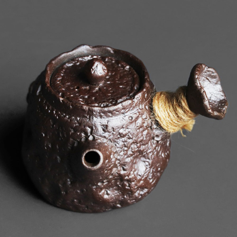 Elegant Japanese stone teapot with natural mineral clay finish and hemp rope handle