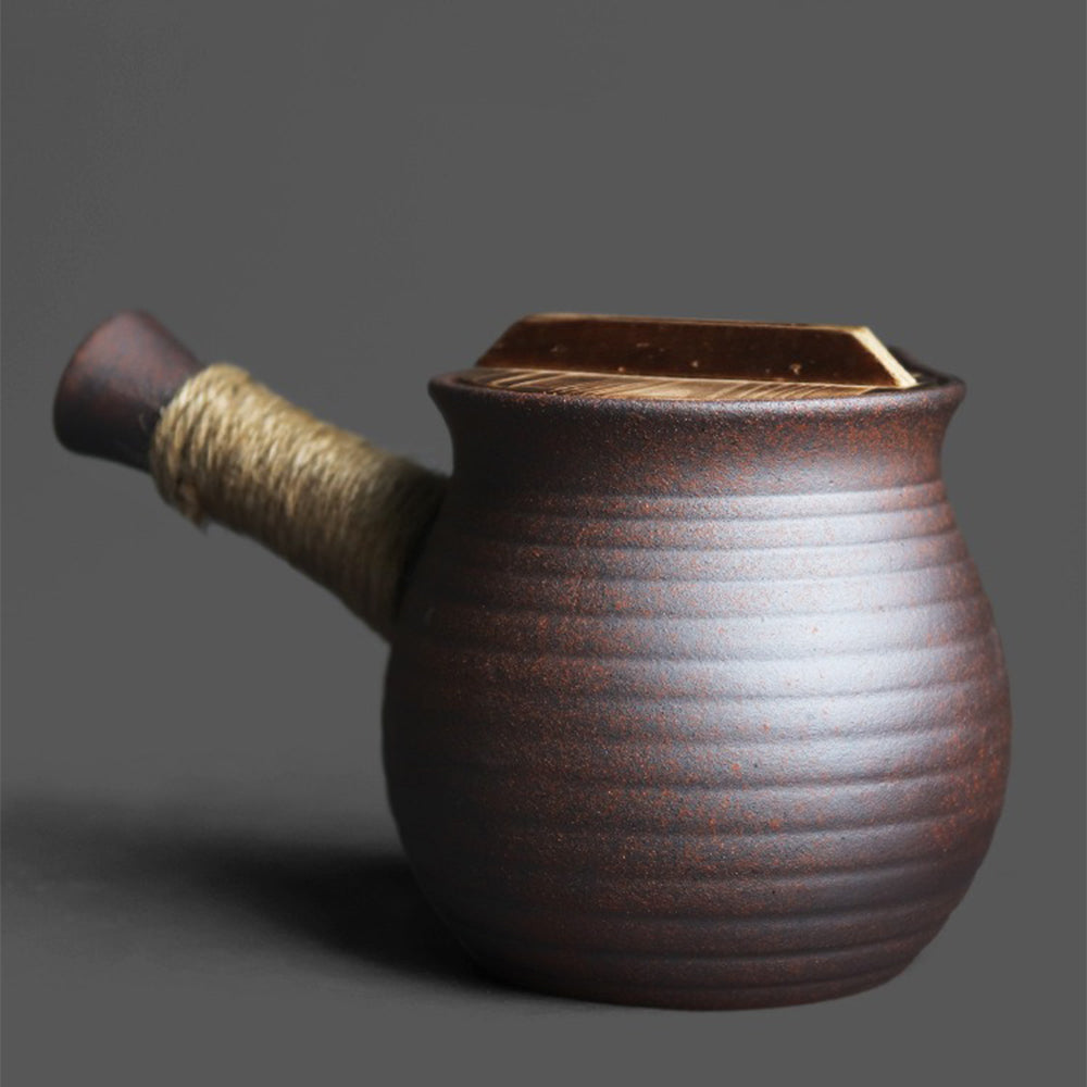 Close-up of ceramic teapot highlighting the intricate texture and design.