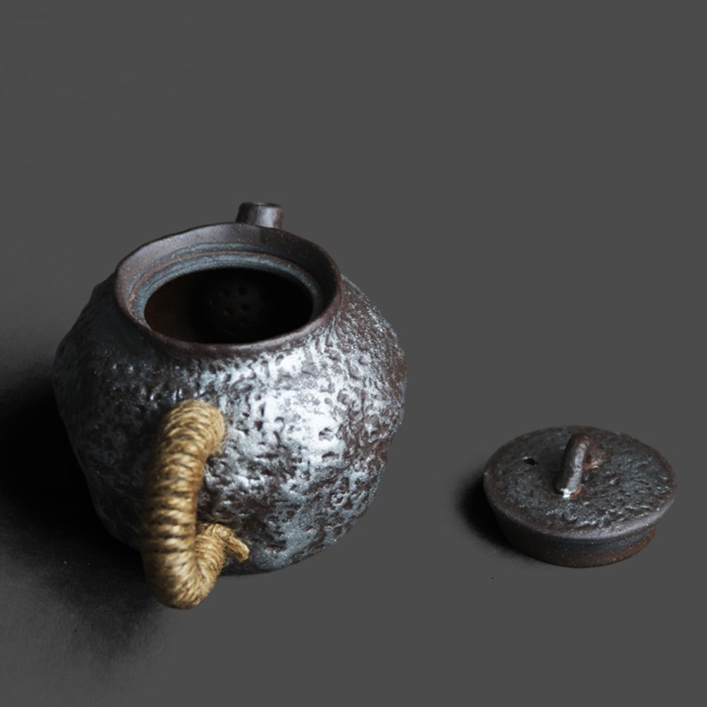 Top view of the Japanese teapot showing silver detailing and stone texture