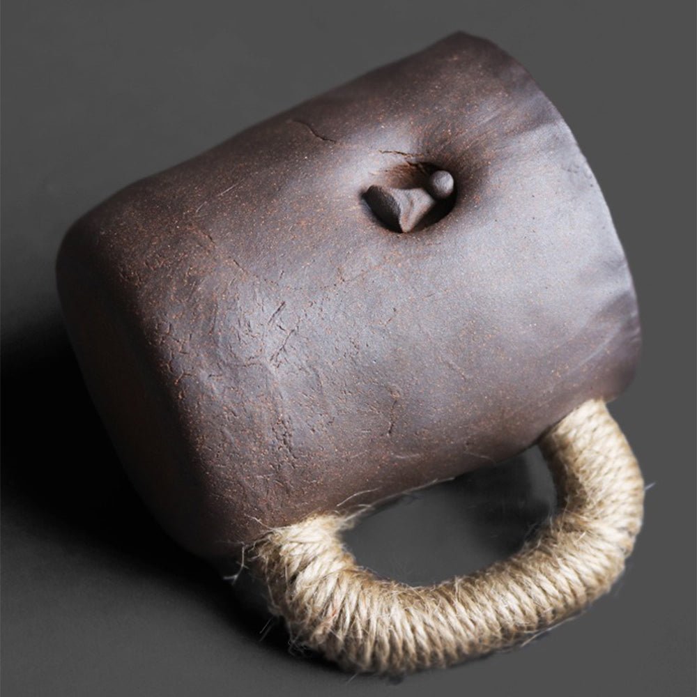 Top view of filter tea cup for brewing, highlighting spherical filter hole inside