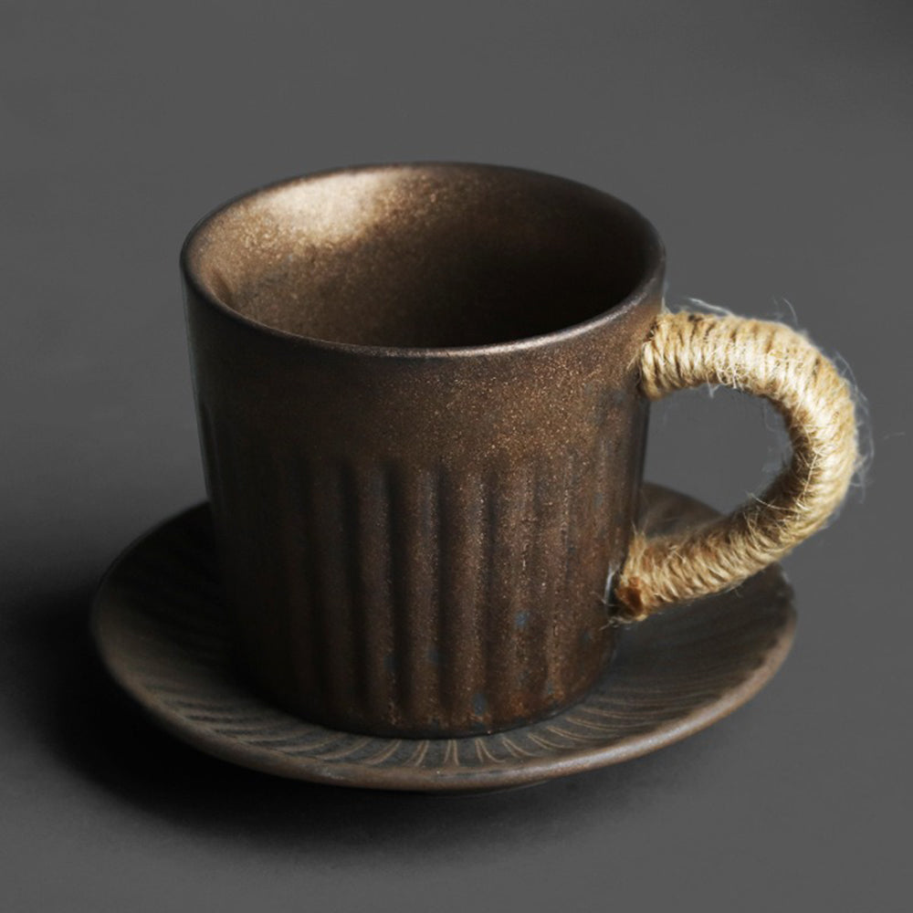 Side view of Japanese ceramic tea set with rustic design and hemp rope handle