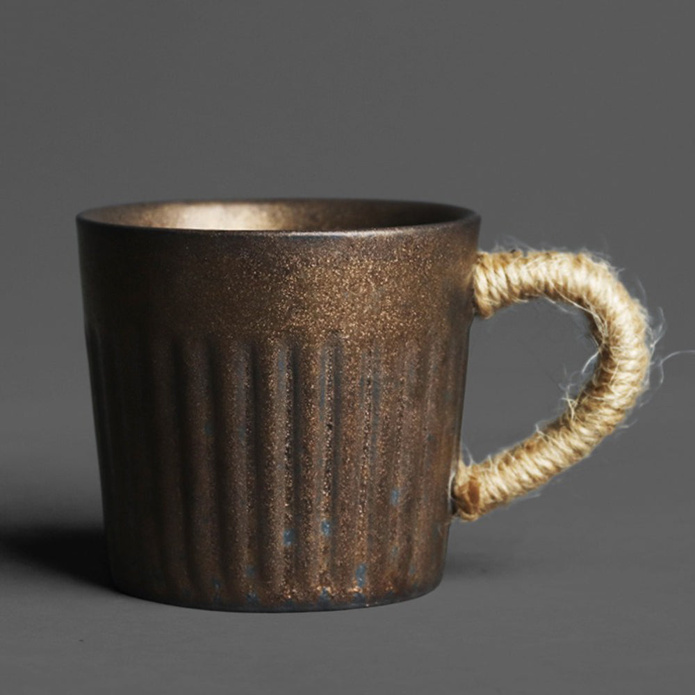 Side view of Japanese ceramic tea set with rustic design and hemp rope handle