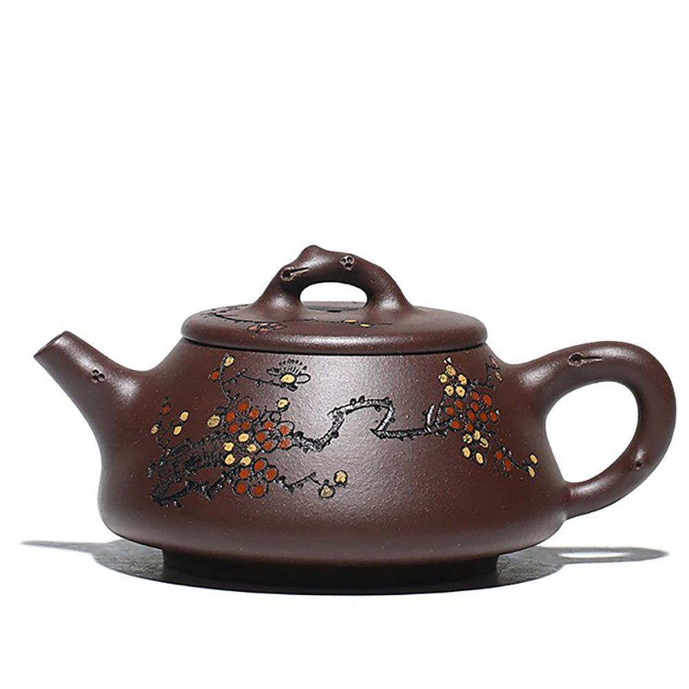 Side view of the premium purple clay teapot showcasing the intricate plum blossom design.