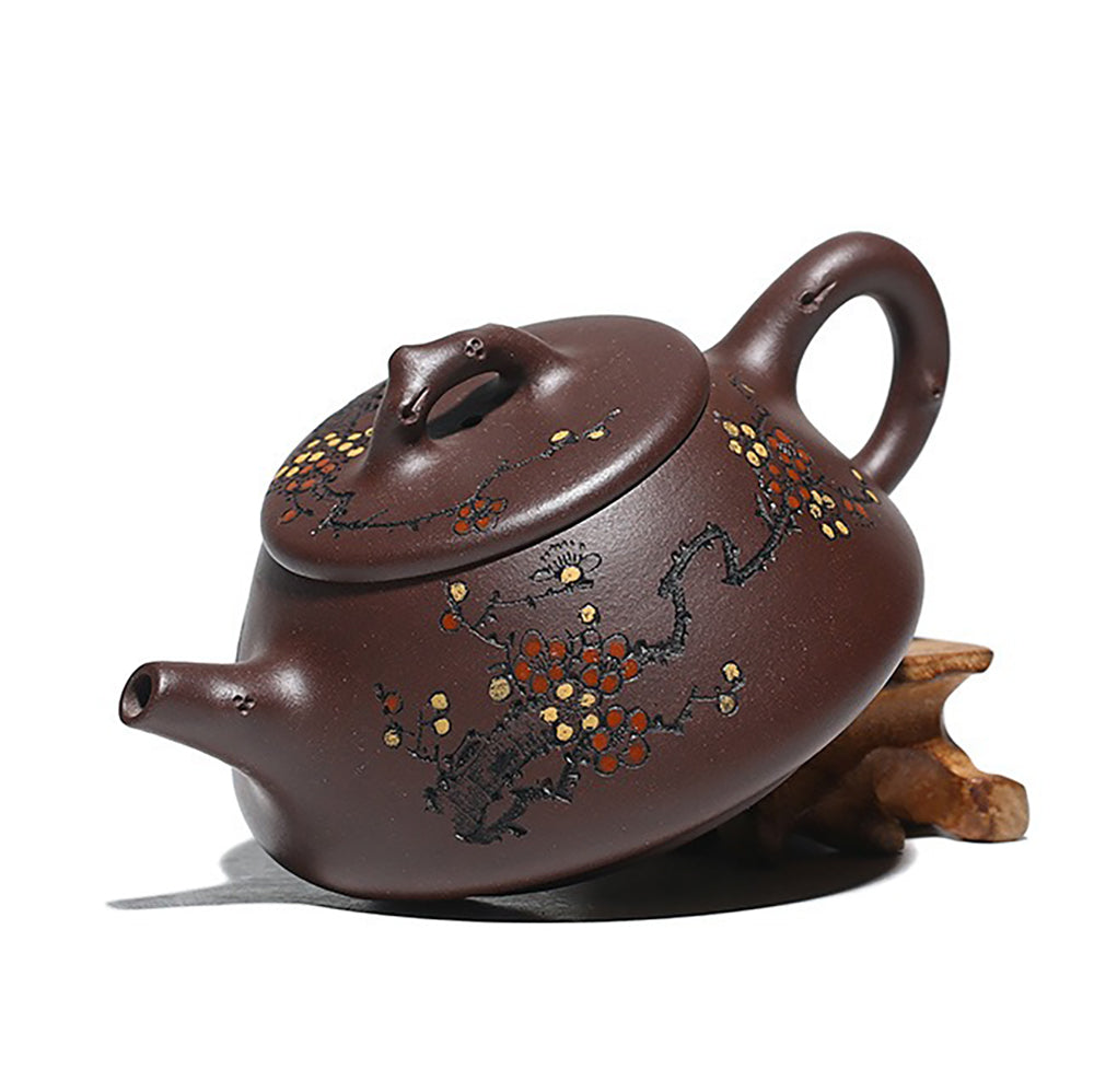 Top-down view of the purple clay teapot lid resembling natural branches, emphasizing the connection to nature.