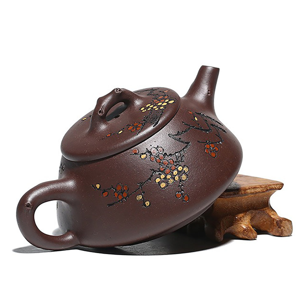Side view of the premium purple clay teapot showcasing the intricate plum blossom design.