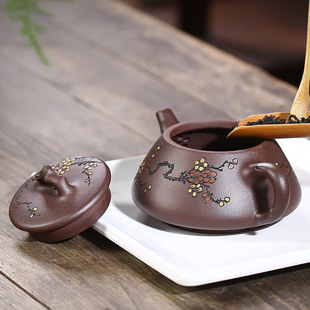 Top-down view of the purple clay teapot lid resembling natural branches, emphasizing the connection to nature.