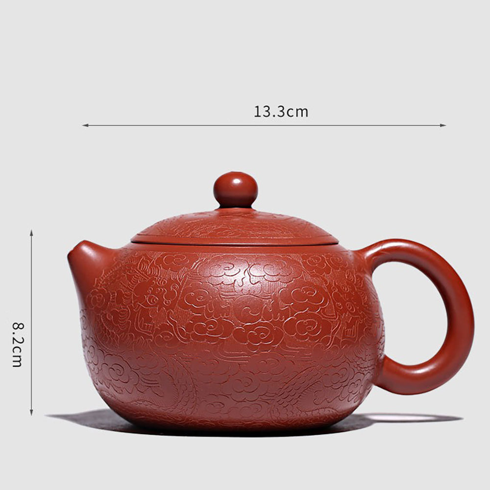 Elegant Yixing teapot with auspicious cloud patterns, perfect for tea ceremonies.