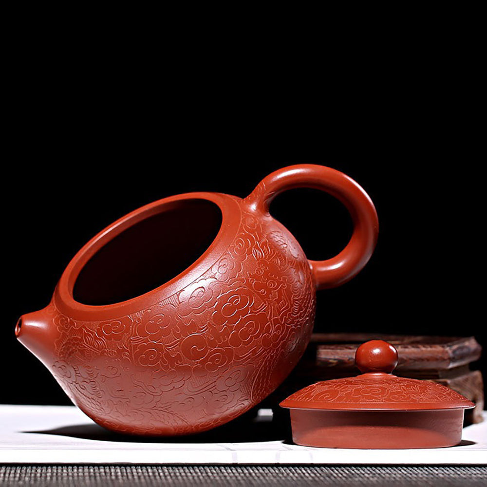 Close-up of the handcrafted Yixing teapot, highlighting its rich purple clay texture.
